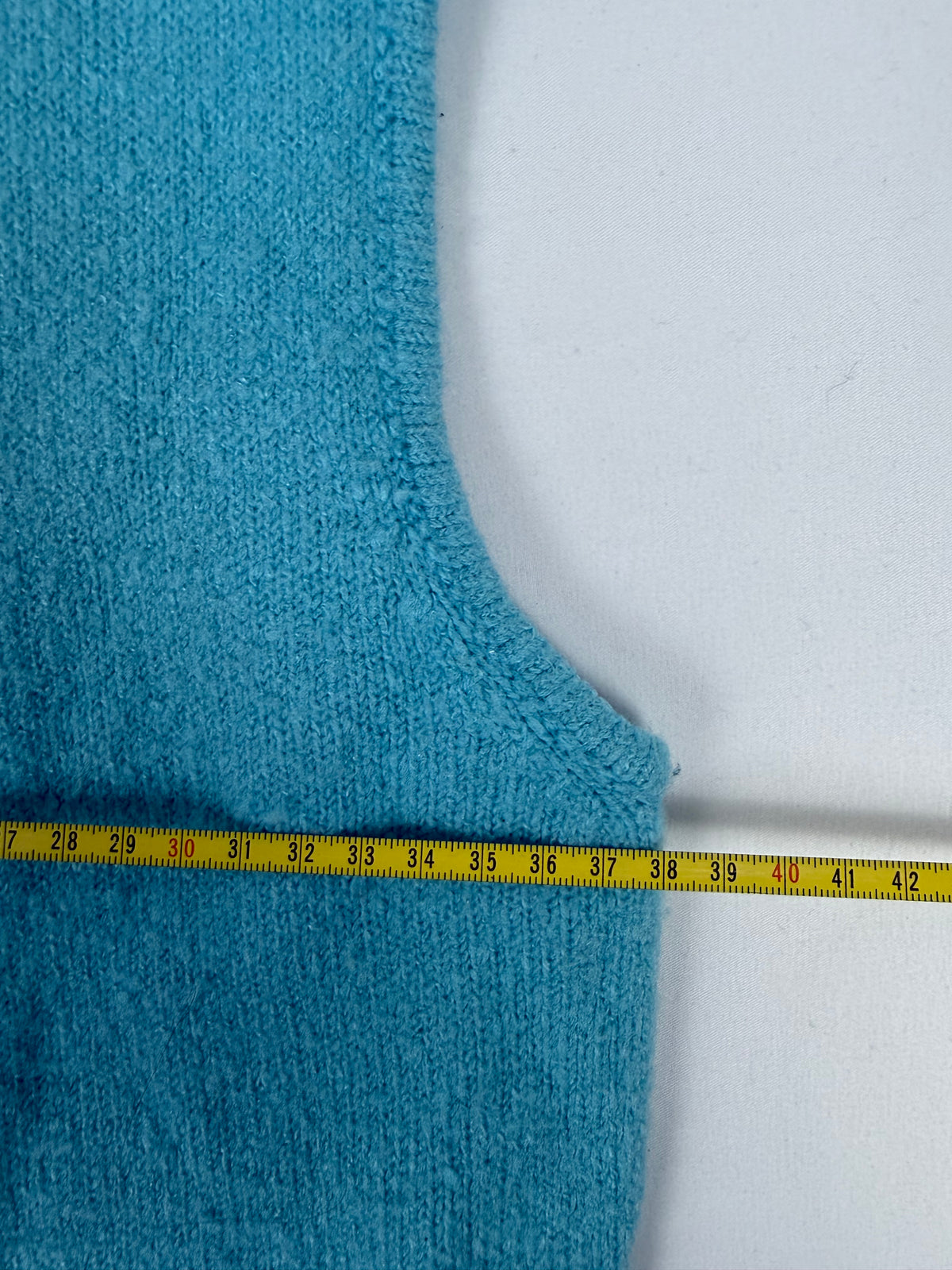 Blue sleeveless jumper (M)