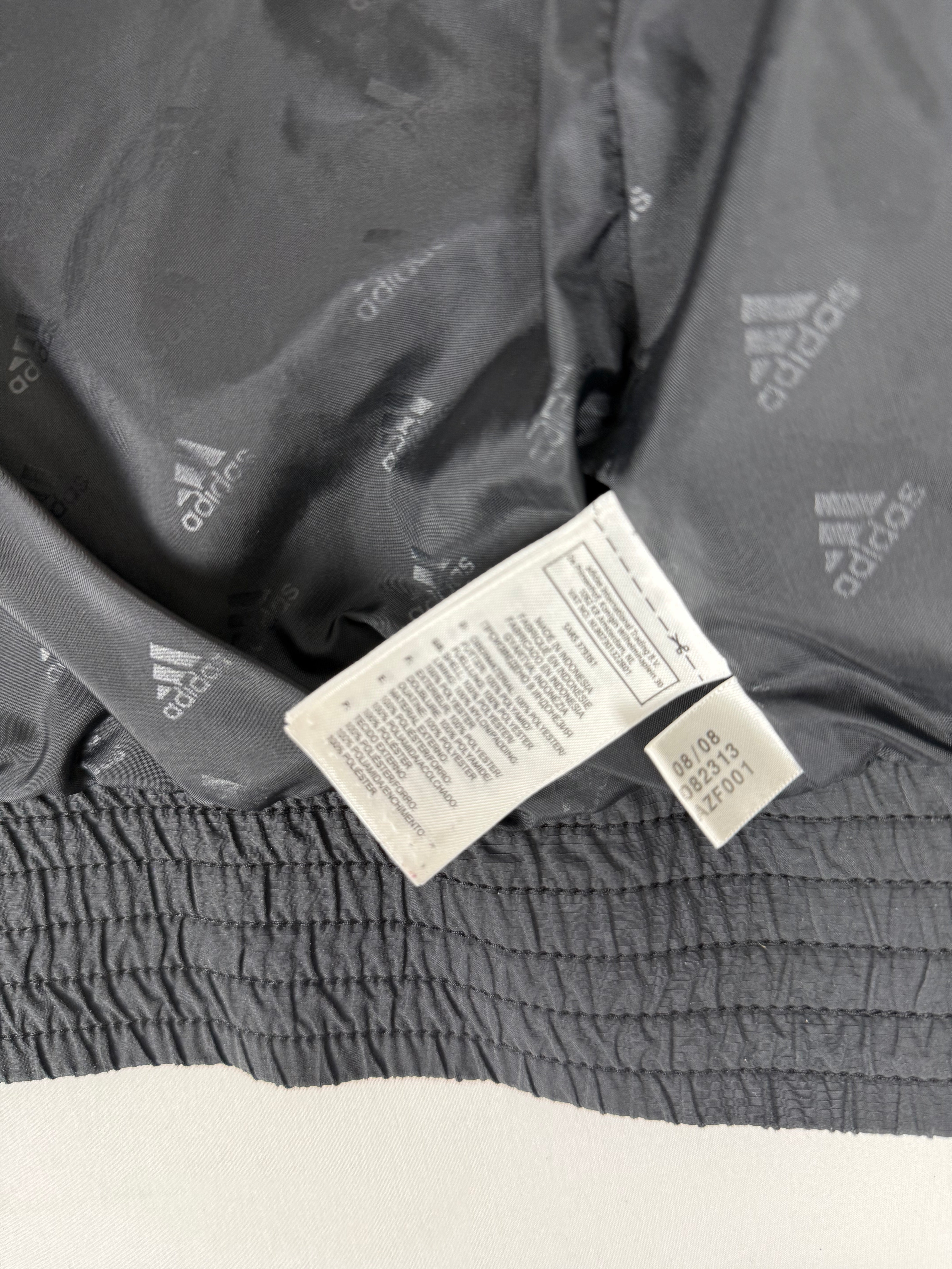 Black zip up puffer jacket (L)