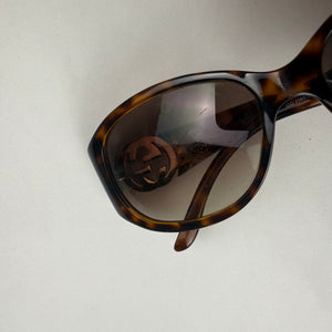 Brown 2000s gold logo sunglasses