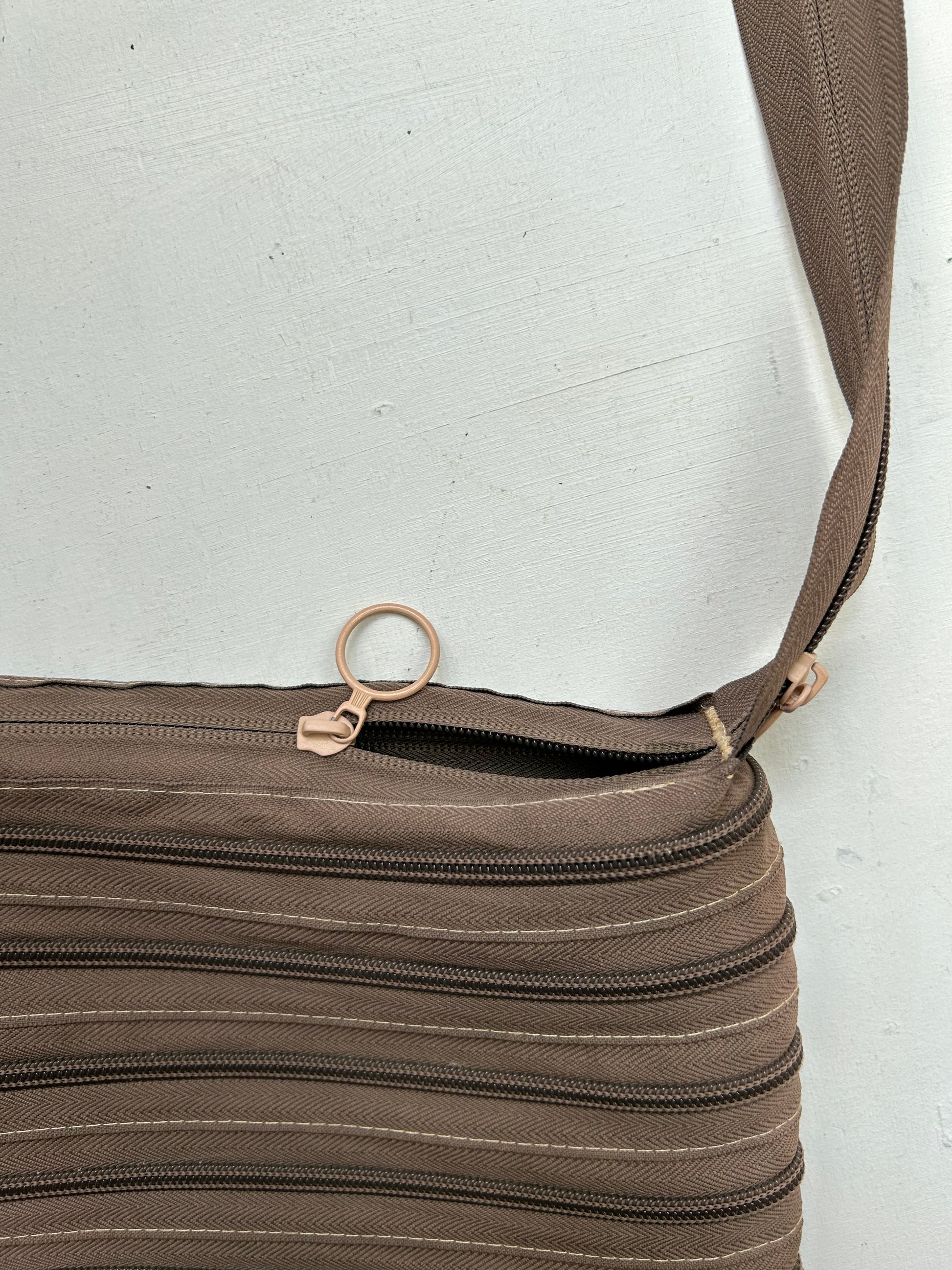 Brown zip up besace crossbody bag