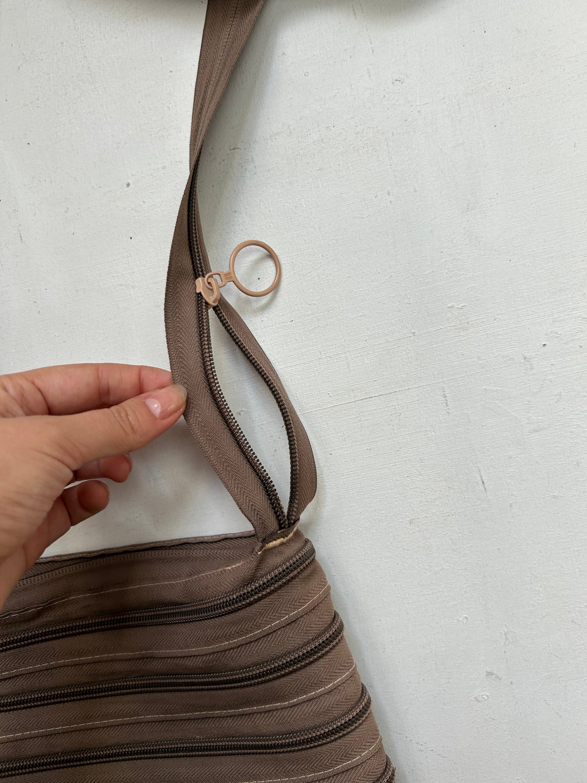 Brown zip up besace crossbody bag